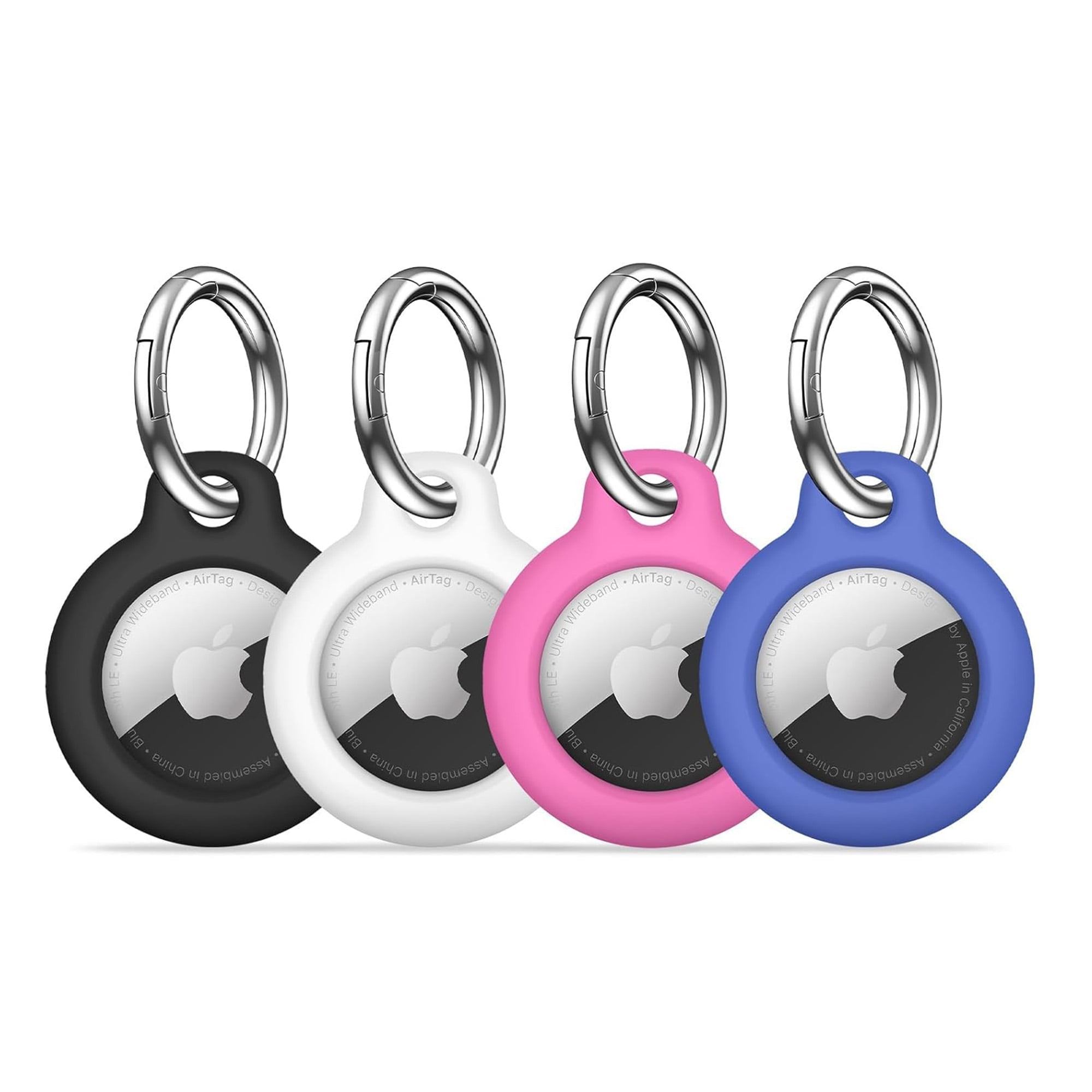 Vier farbige AirTag-Schlüsselanhänger. Schwarz, weiß, rosa und blau in einer Reihe. Apple-Logo sichtbar.