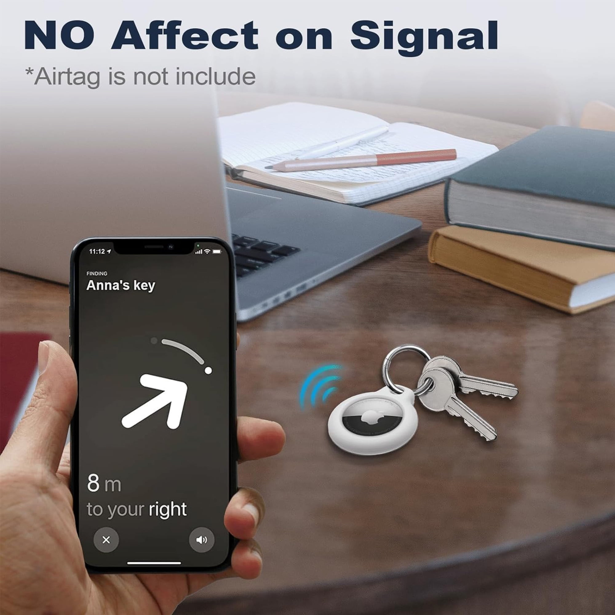 Telefon mit AirTag und Schlüsseln auf einem Tisch. Text: KEINE Auswirkung auf das Signal.