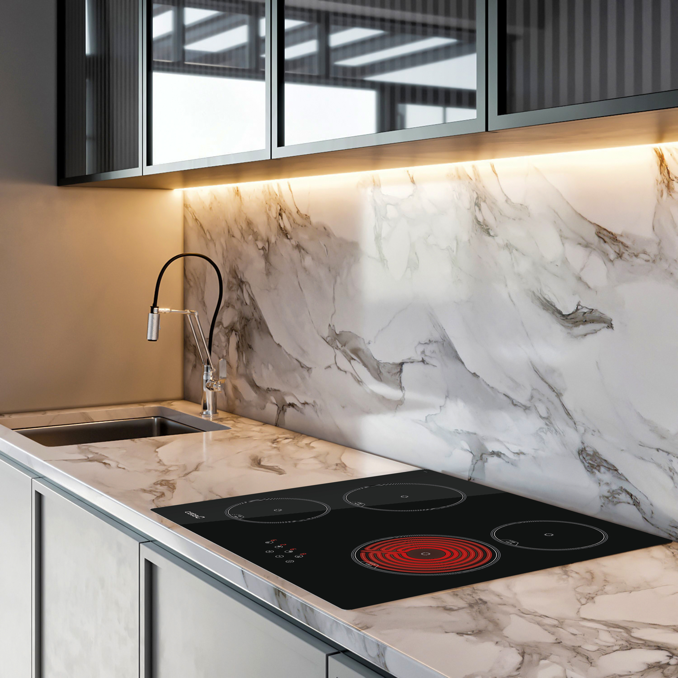Cocina moderna con encimera de mármol y placa de inducción negra.