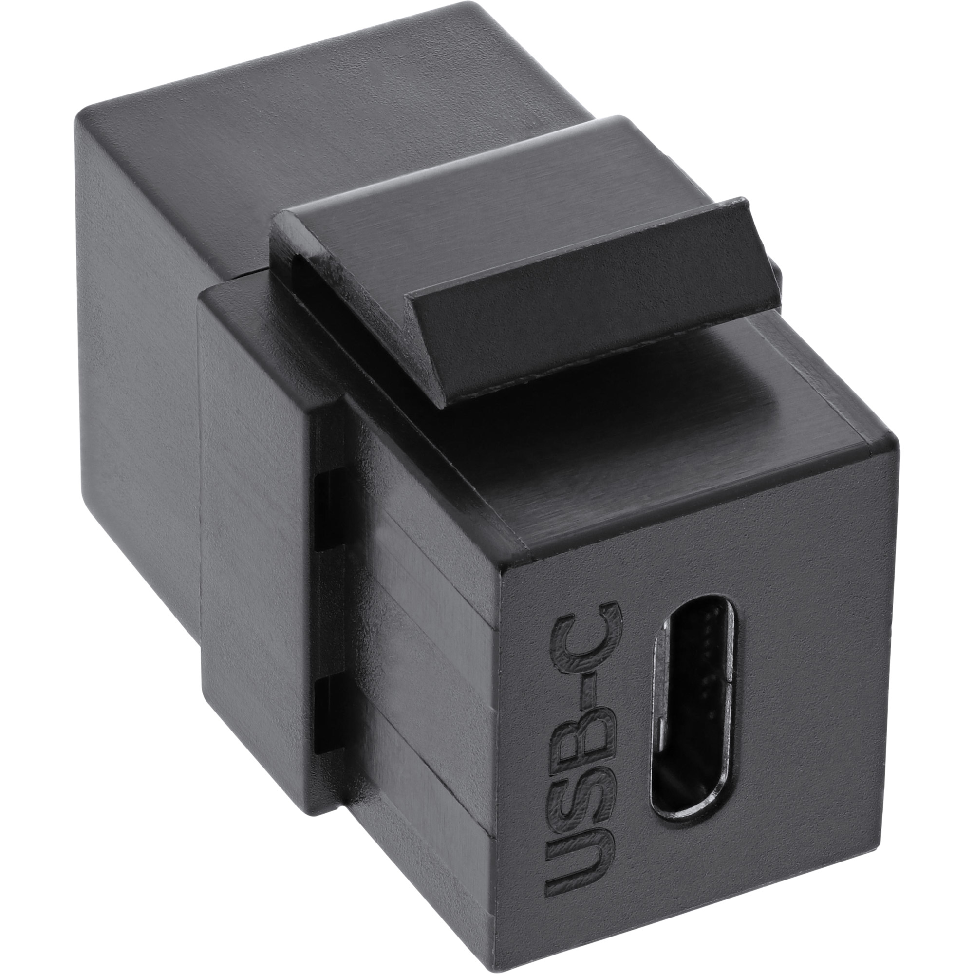 Ein schwarzer USB-C-Adapter. Es ist ein kleines, rechteckiges Gerät mit einem USB-C-Anschluss.