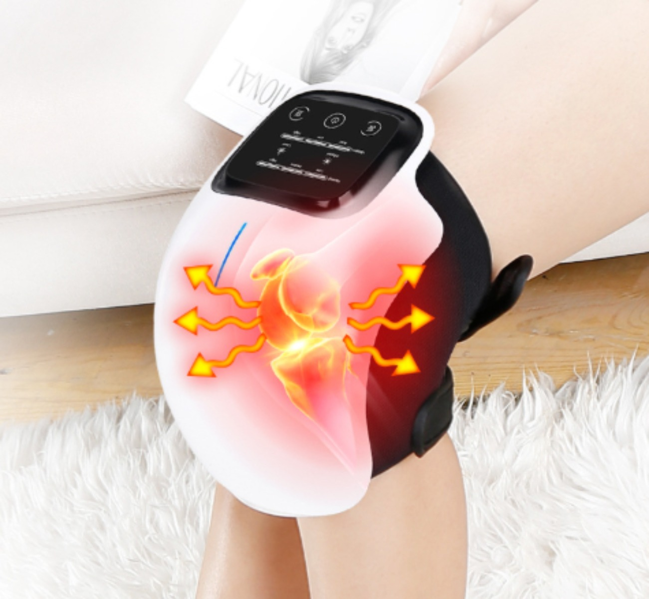 Kniemassagegerät am Knie, mit Wärmepfeilen. Das Bild zeigt ein Knie mit einem Massagegerät.