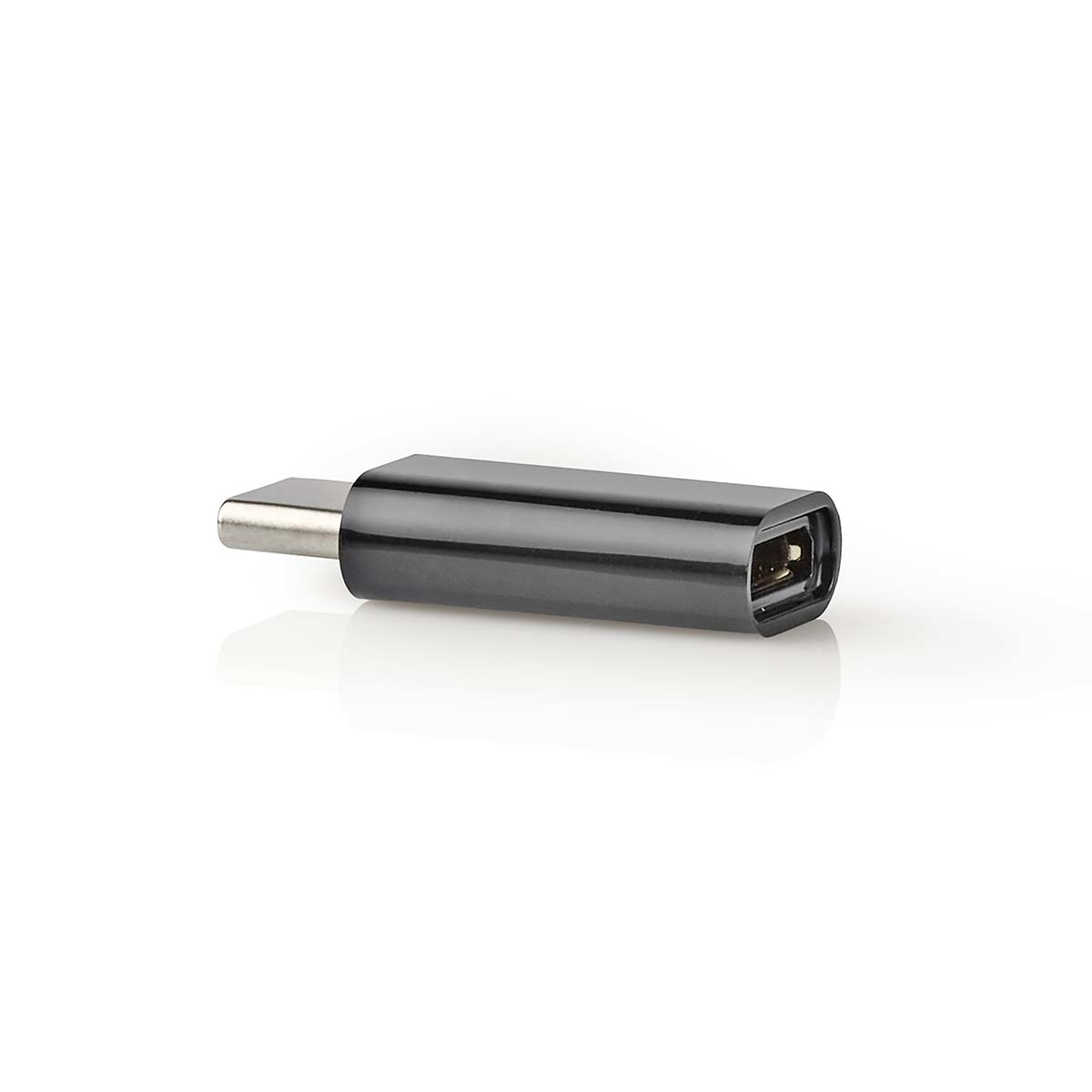 Un adattatore USB-C nero su una superficie bianca. È un dispositivo compatto con finitura metallica.
