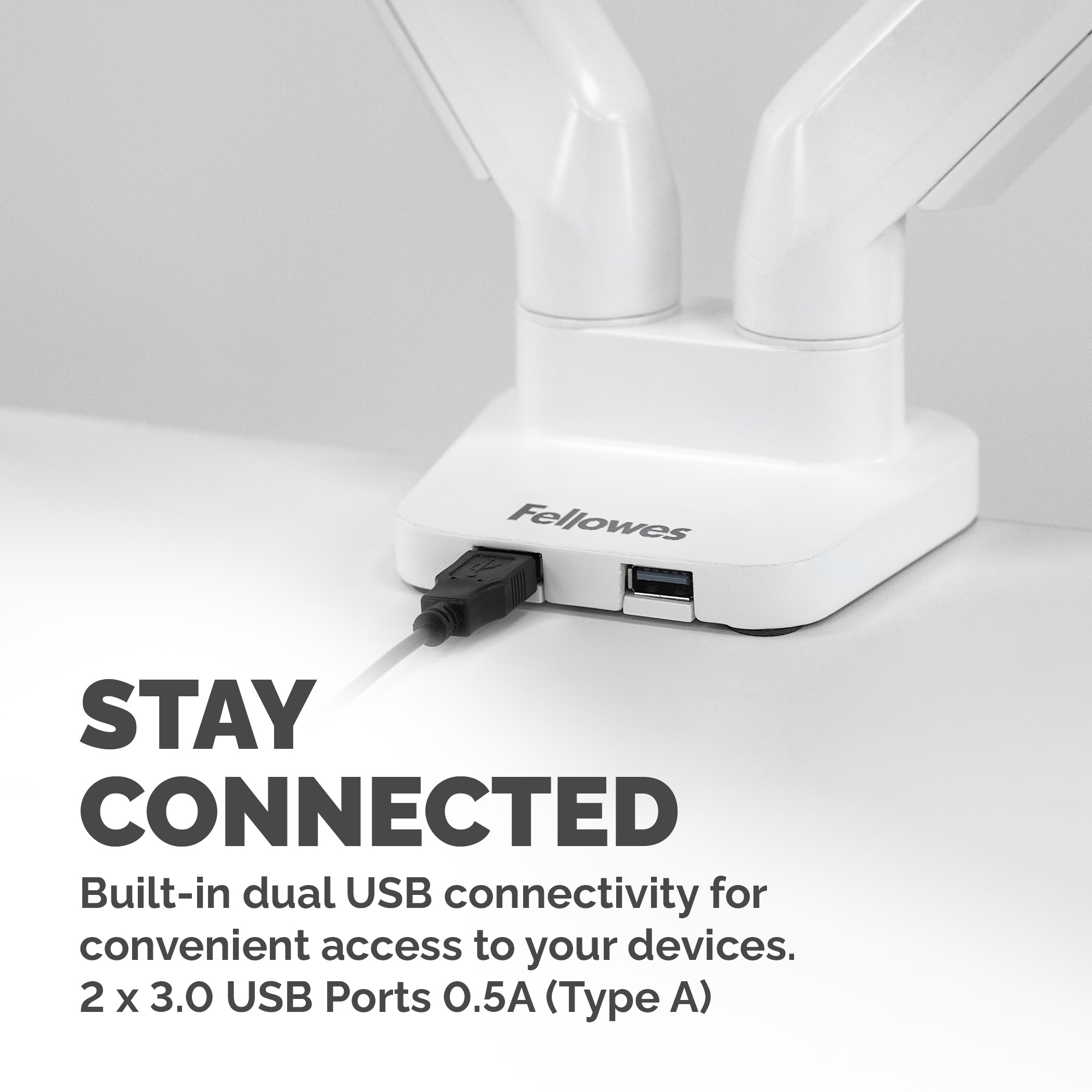White USB hub with black USB cable connected. White background.