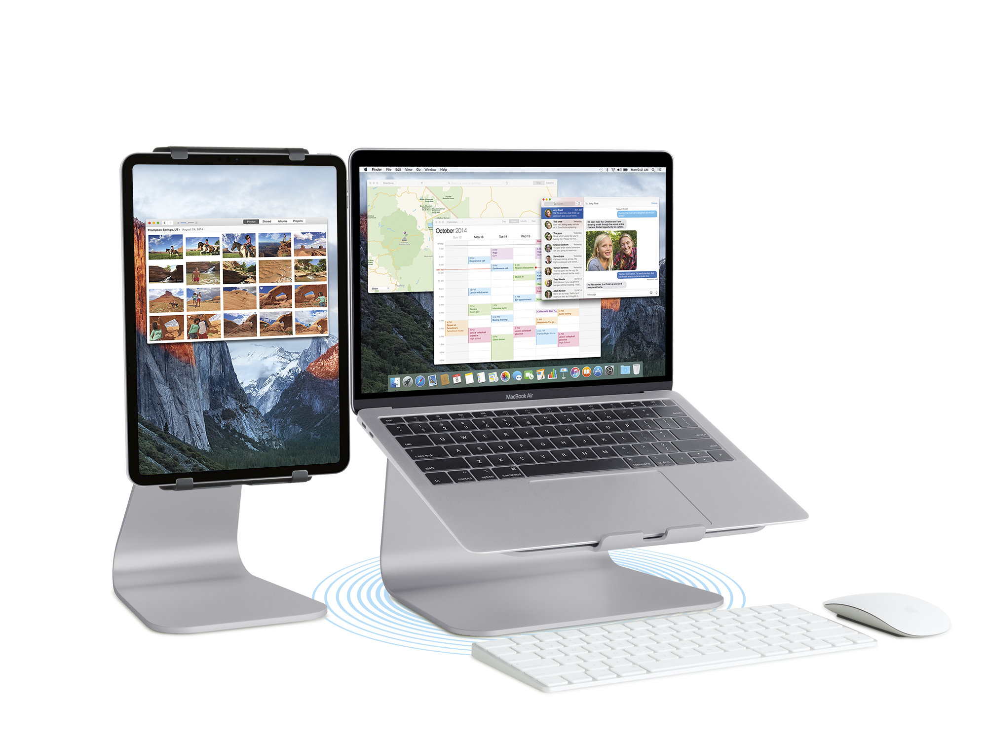 Ein Laptop und ein Tablet stehen auf Ständern. Eine Tastatur und eine Maus liegen auf dem Schreibtisch. Beide Bildschirme sind an.