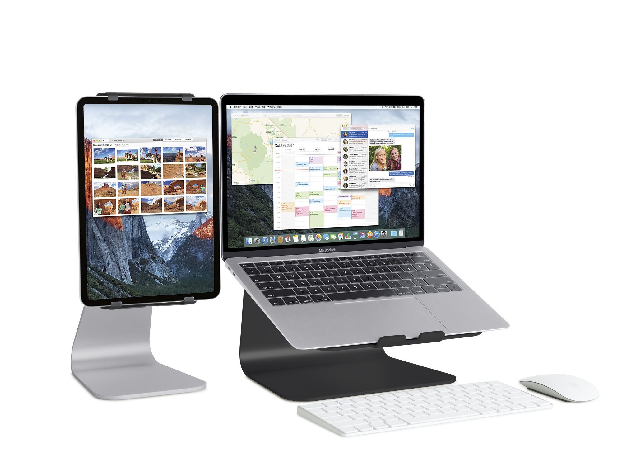 A laptop and a tablet on stands, keyboard, and mouse. The laptop and tablet display different interfaces.