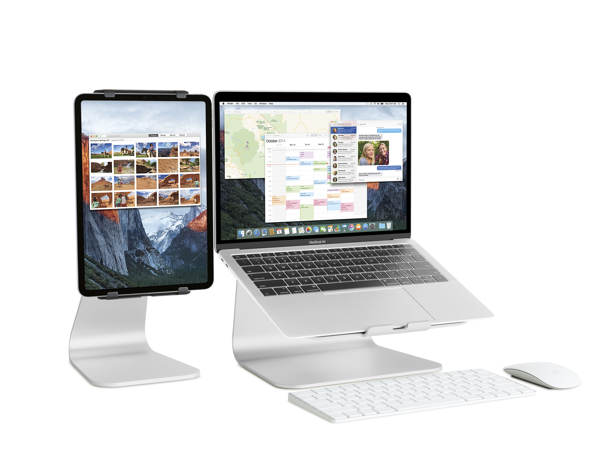 Laptop, Tablet, Tastatur und Maus auf weißen Ständern. Bildschirme zeigen Karten und einen Kalender.