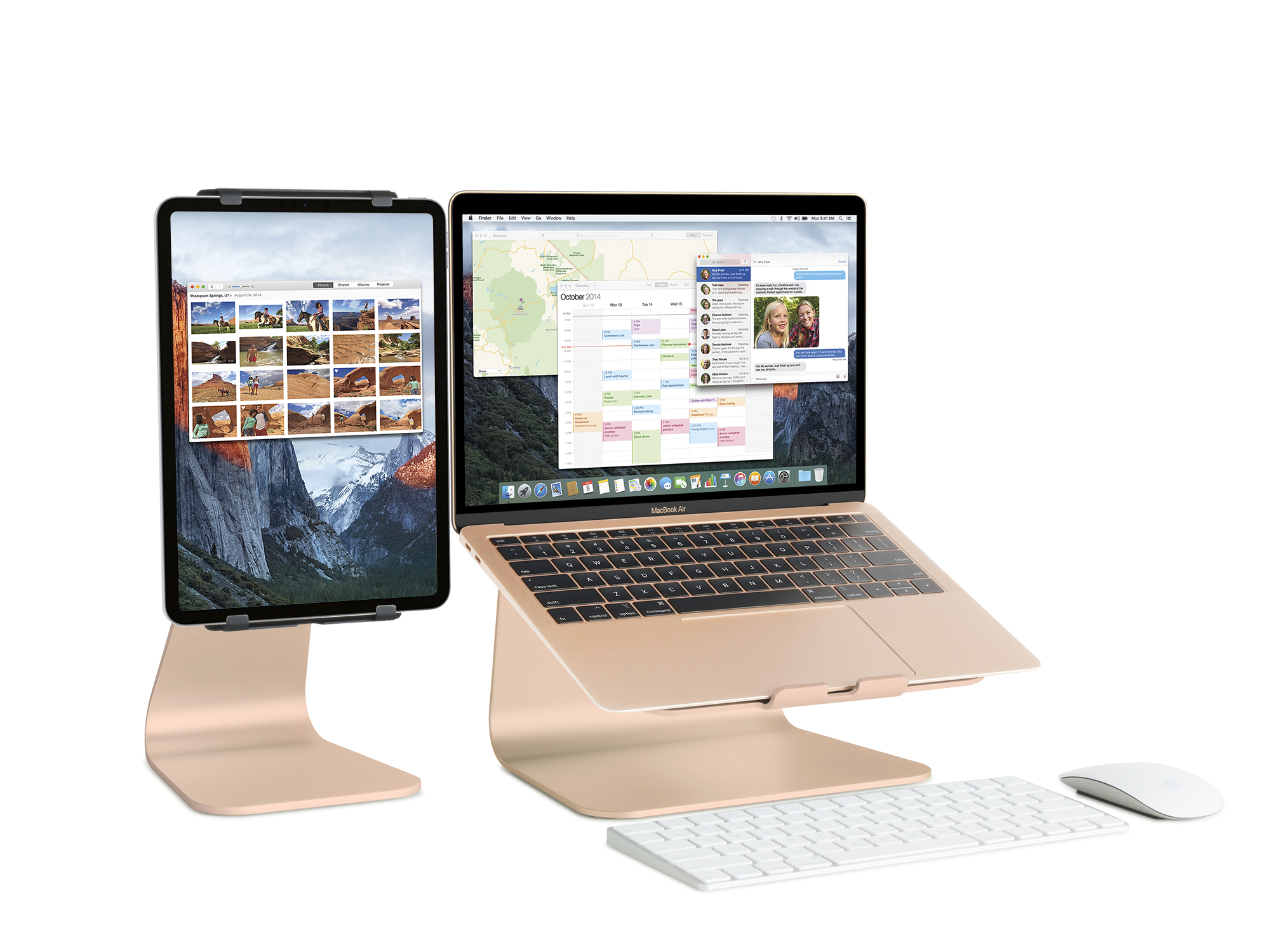 Ein Laptop und ein Tablet auf goldenen Ständern. Eine Tastatur und eine Maus befinden sich davor.