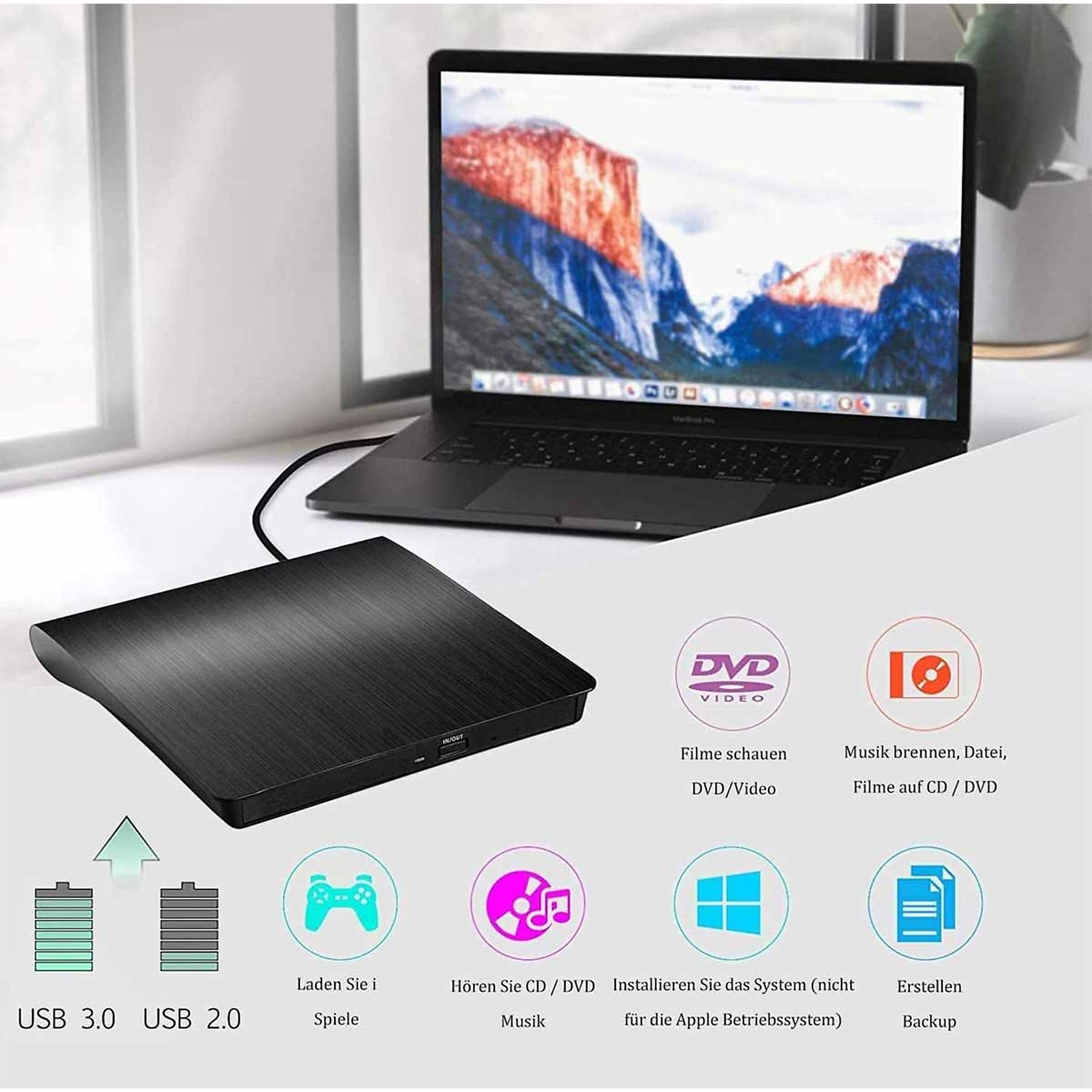Ein schwarzes Gerät neben einem Laptop. Das Gerät hat einen USB-Eingang und Beschriftungen.