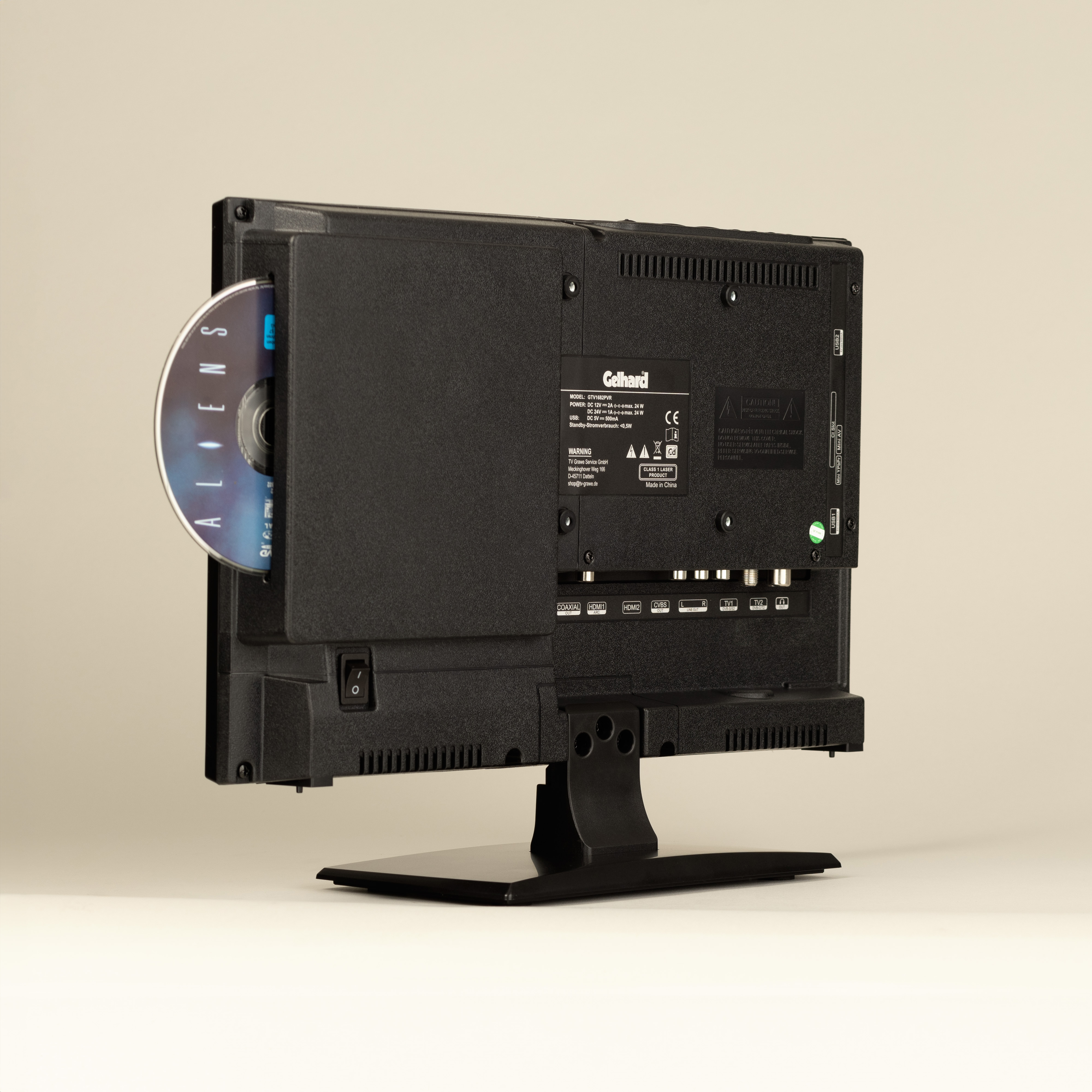 Ein schwarzer Fernseher mit eingelegter DVD, der die Rückseite des Fernsehers zeigt.