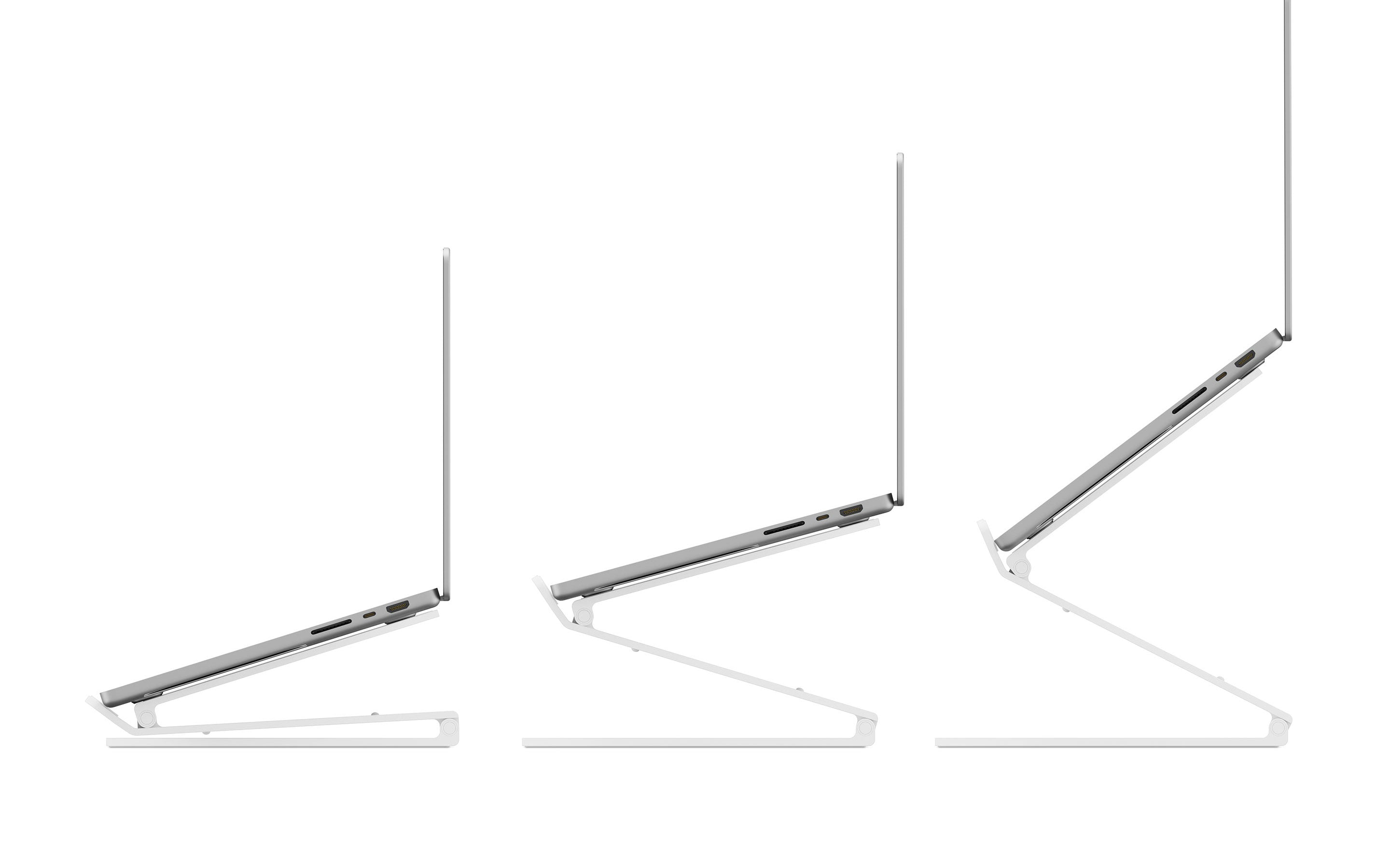 Three laptop stands in white, supporting laptops at different angles.