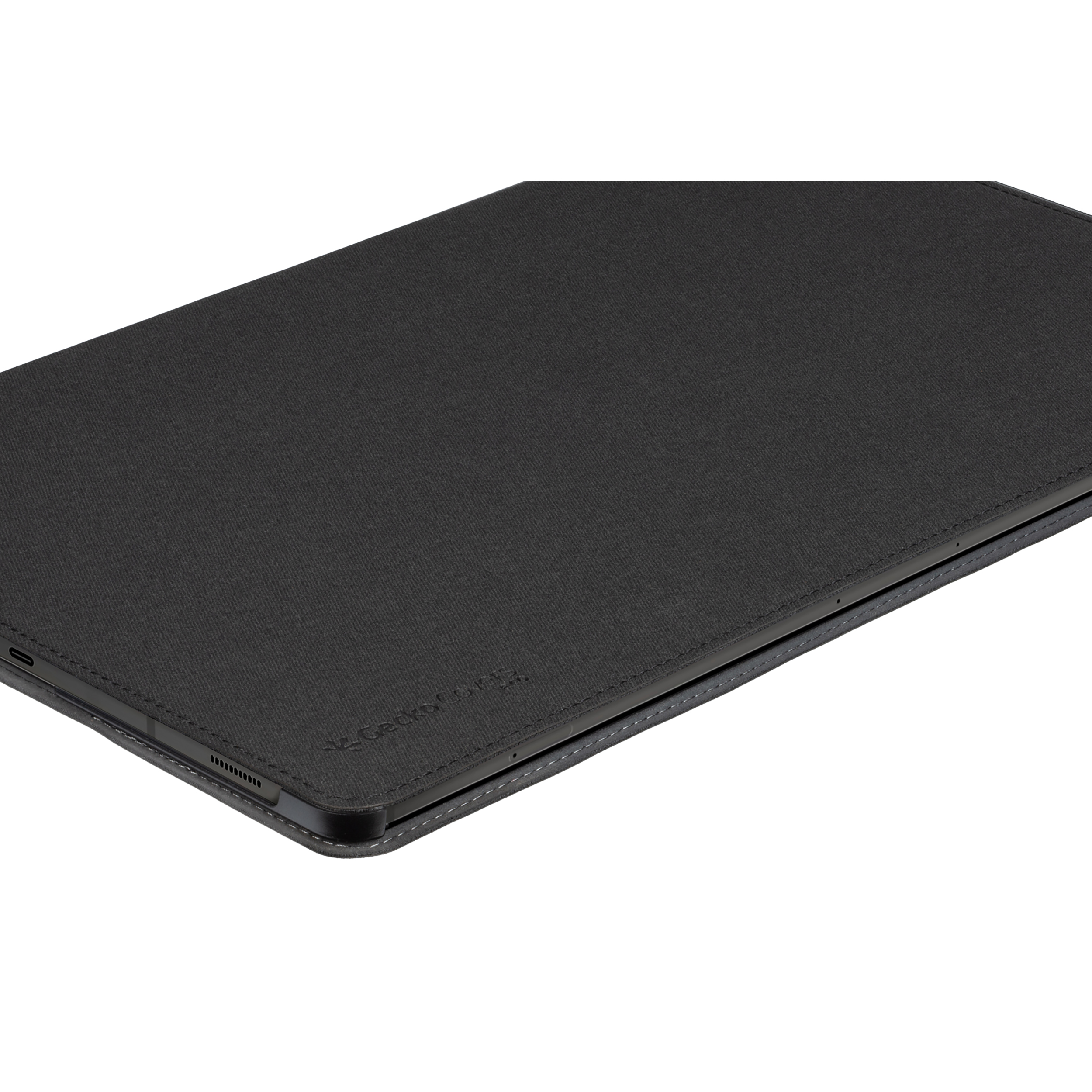 Custodia per tablet nera su superficie bianca. La custodia è chiusa. La custodia è di colore scuro.