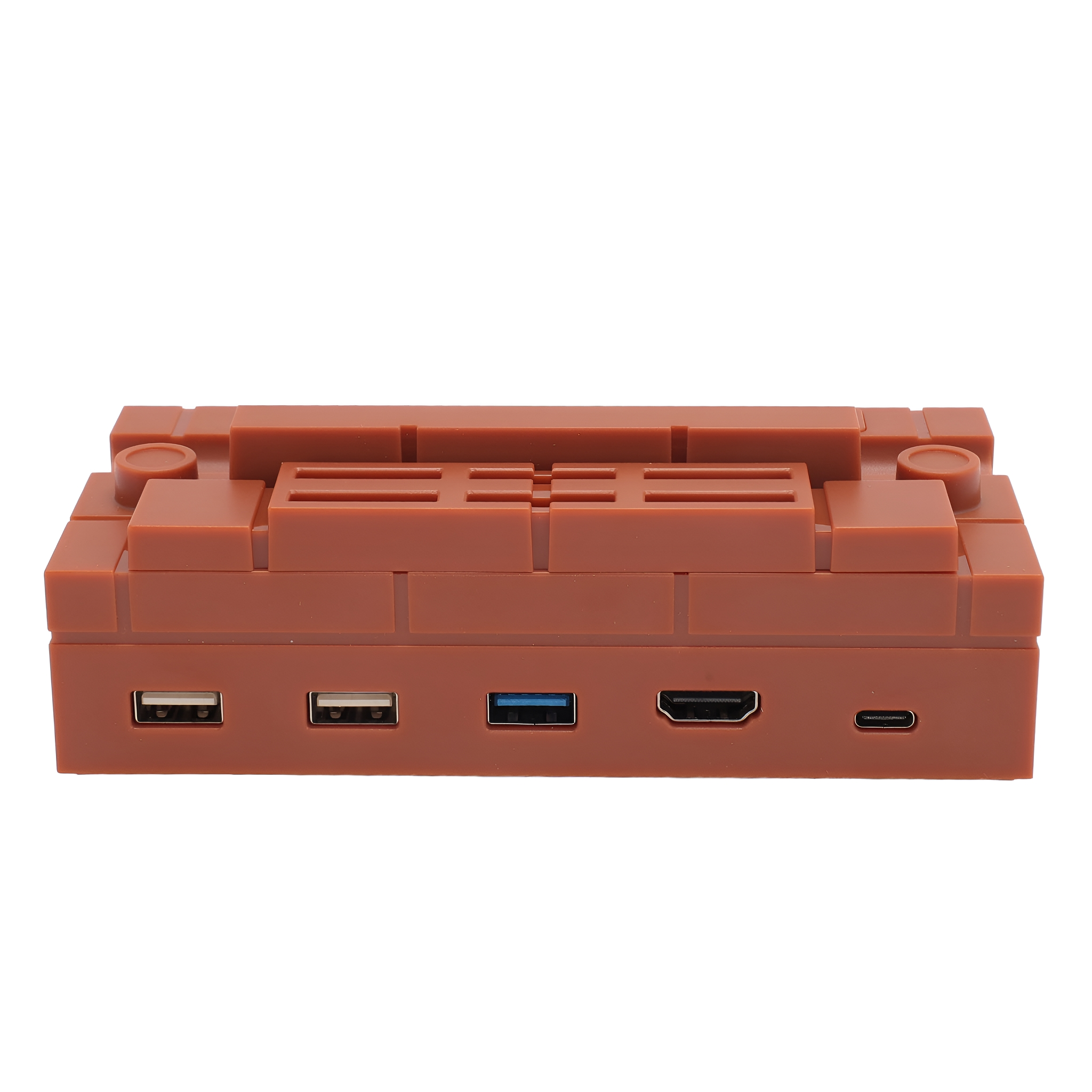 Braunes, ziegelsteinförmiges Gerät mit USB- und HDMI-Anschlüssen auf weißem Hintergrund.