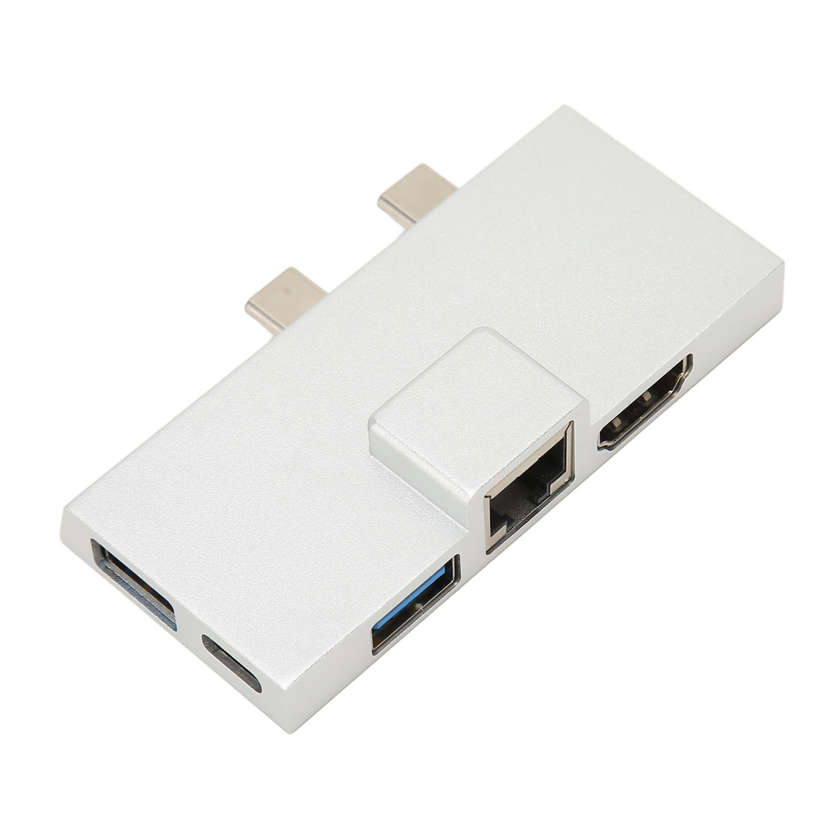 Silberner Multi-Port-Adapter mit USB-, HDMI-, Ethernet- und USB-C-Anschlüssen. Er liegt auf einer weißen Oberfläche.
