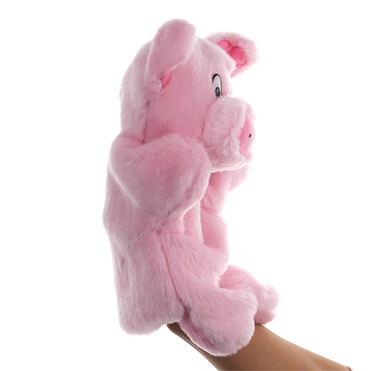 Rosa Schwein-Handpuppe, Fellstruktur, Seitenansicht, Hand hält Puppe, weißer Hintergrund.