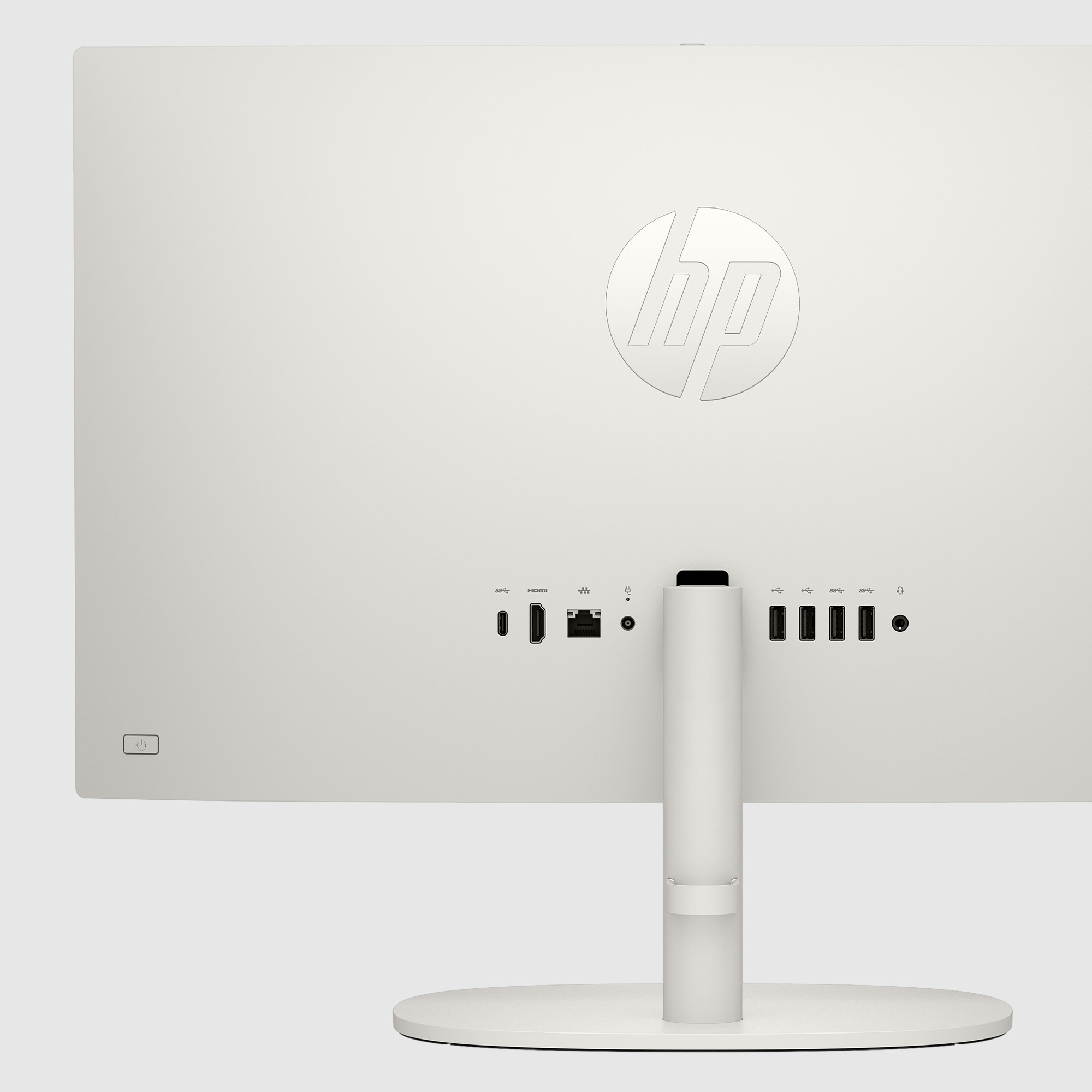 Vista posteriore di un computer HP all-in-one bianco. Porte, un supporto e il logo HP sono visibili.