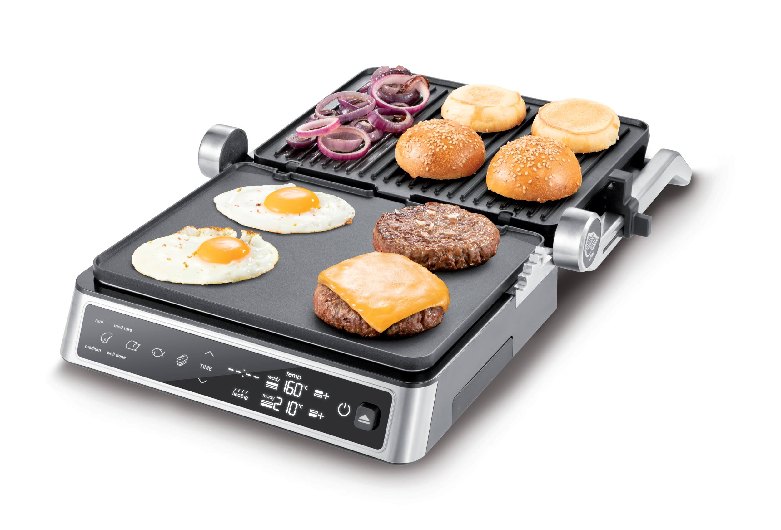 Grill mit Eiern, Burgern, Brötchen und Zwiebeln. Silberner Grill. Weißer Hintergrund.