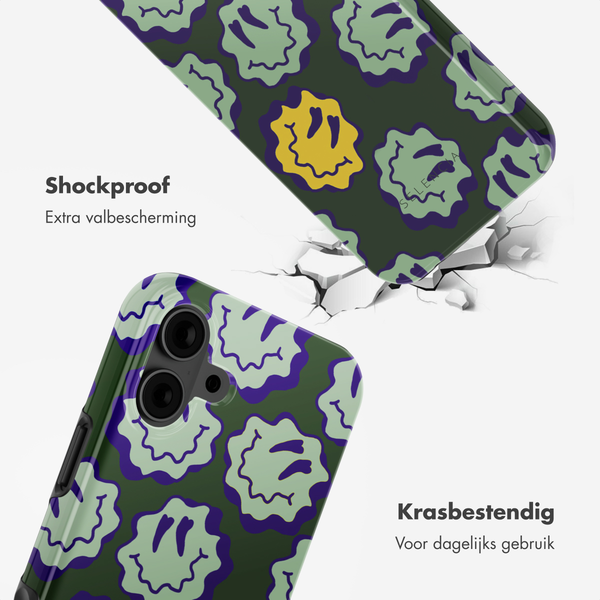Due custodie per telefono con motivo a faccina verde e viola, pavimento incrinato sullo sfondo.