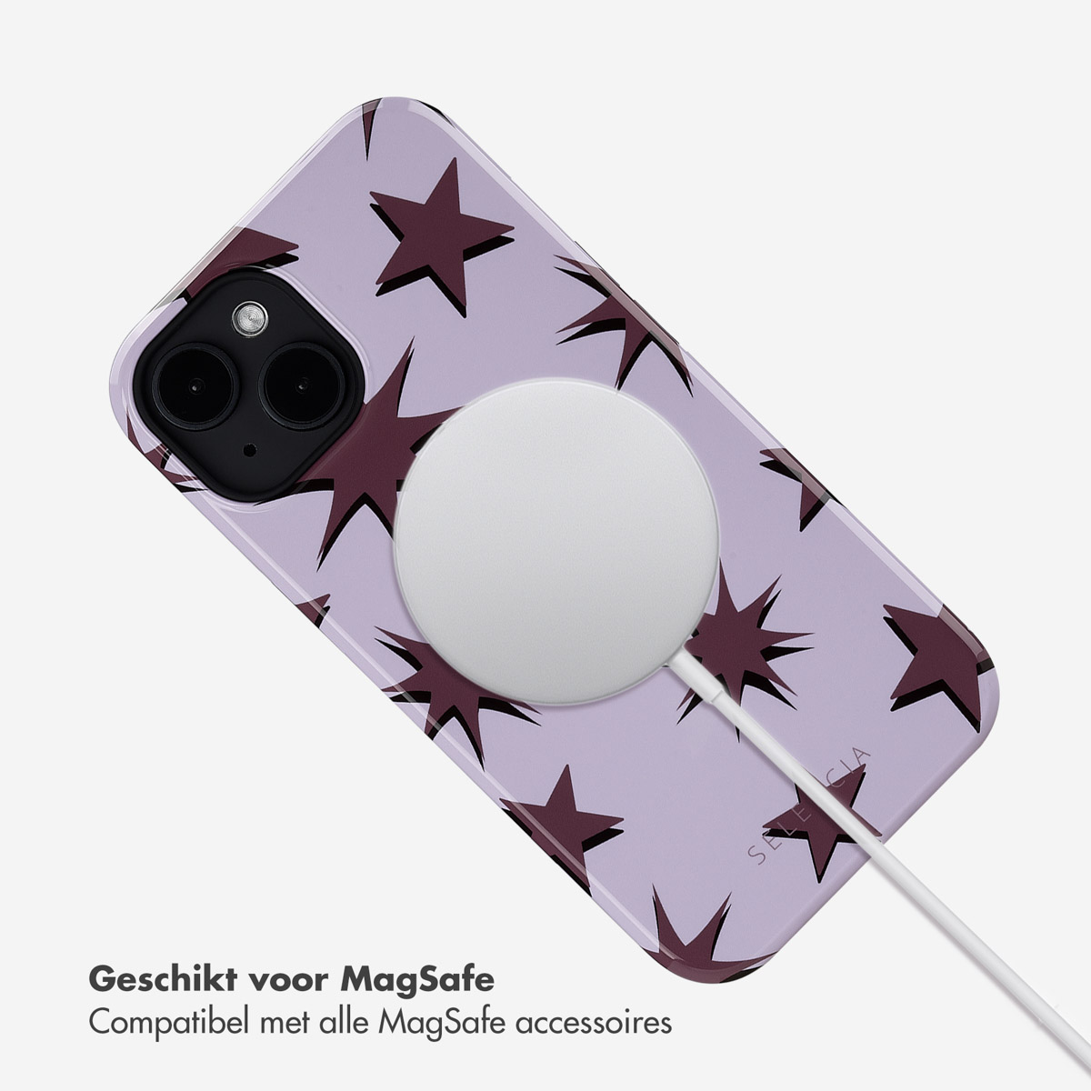 Telefoonhoesje met sterren, witte oplaadpad aangesloten.
