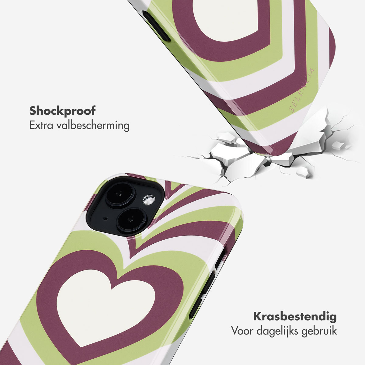 Telefoonhoesje met een groen en wit hart, gebarsten oppervlak eronder.