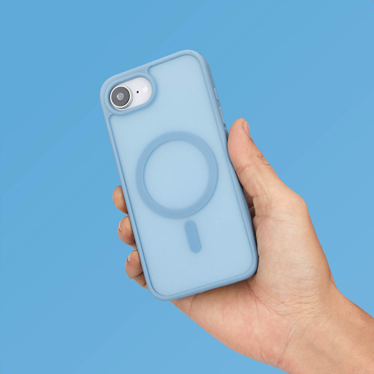 Hand holding a light blue phone with a light blue case. A blue background is behind.