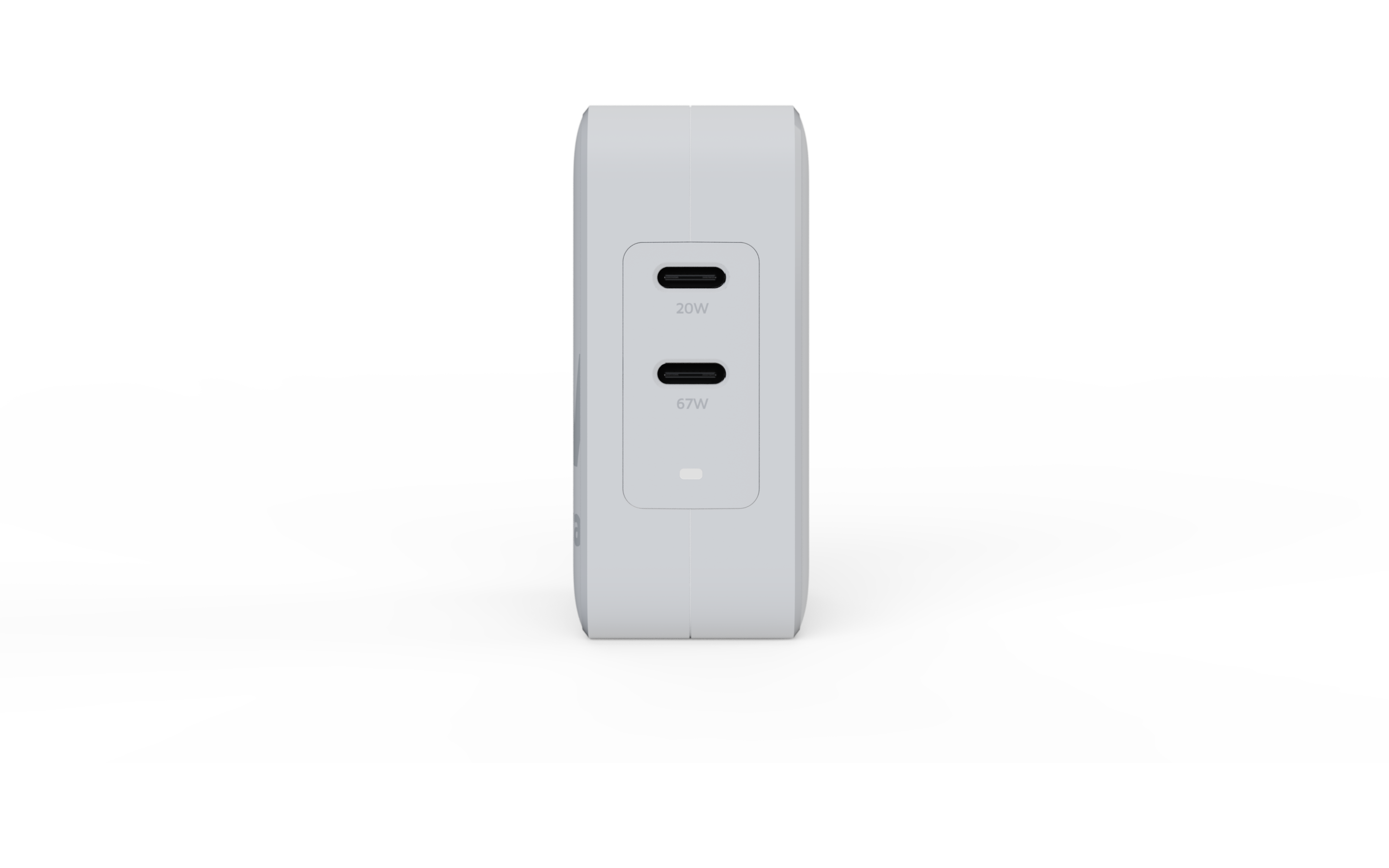 Adaptateur secteur blanc avec deux ports USB-C, étiquetés 20W et 67W, sur une surface blanche.