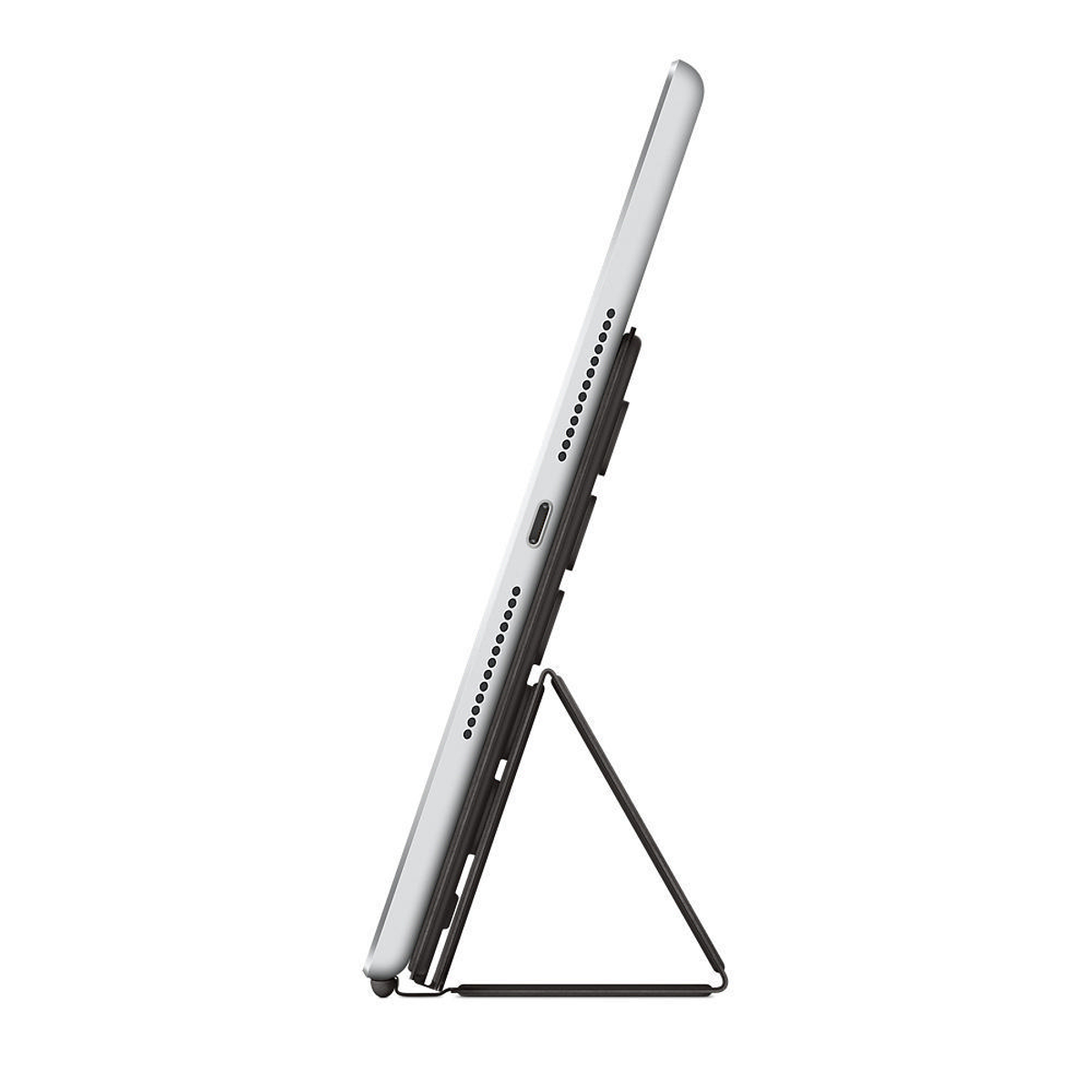 Tablet in un supporto. Vista laterale, bianco e nero, con un supporto.