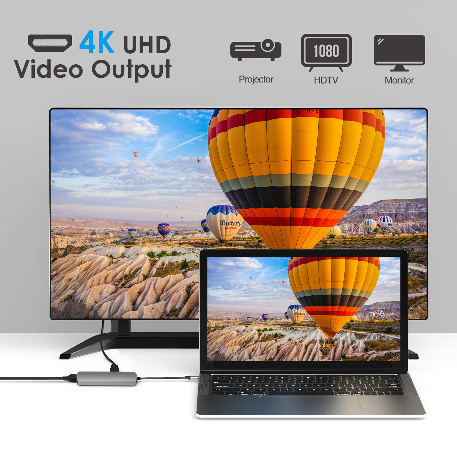 Laptop aangesloten op een monitor, met een heteluchtballonscène. Een projector en HDTV worden ook weergegeven.