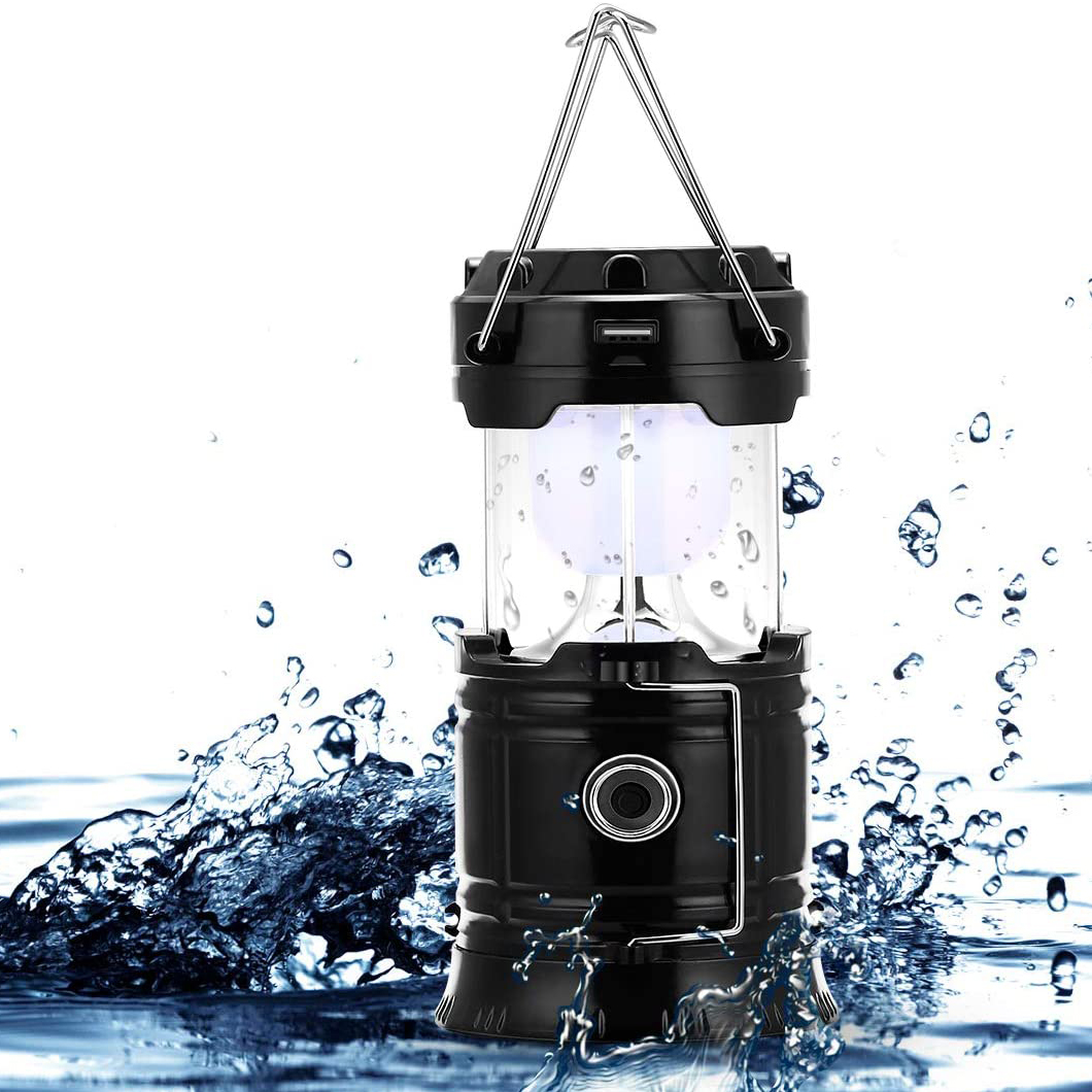 Schwarze Laternen-Lampe mit Wasserspritzern. Hat einen Griff und einen Knopf.
