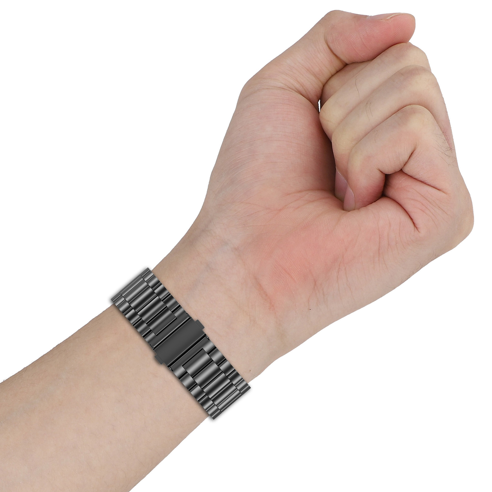 Ein Handgelenk mit einem schwarzen Armband. Das Band hat einen Metallverschluss.