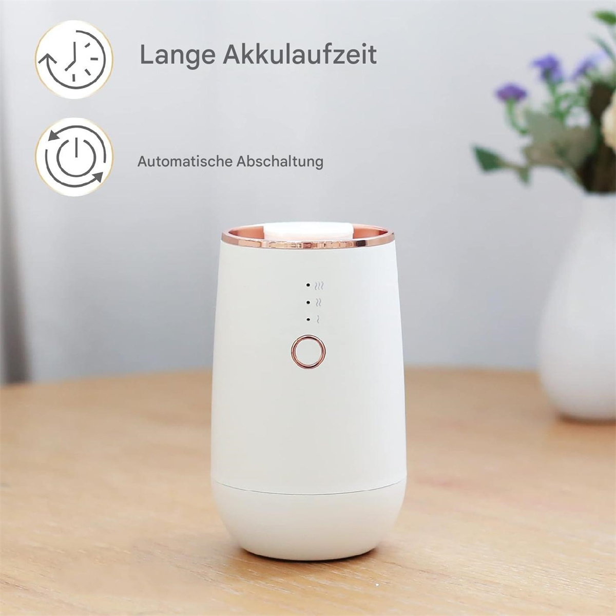Ein weißer und roségoldfarbener Aromadiffusor. Hat die Worte 'Lange Akkulaufzeit' darauf.
