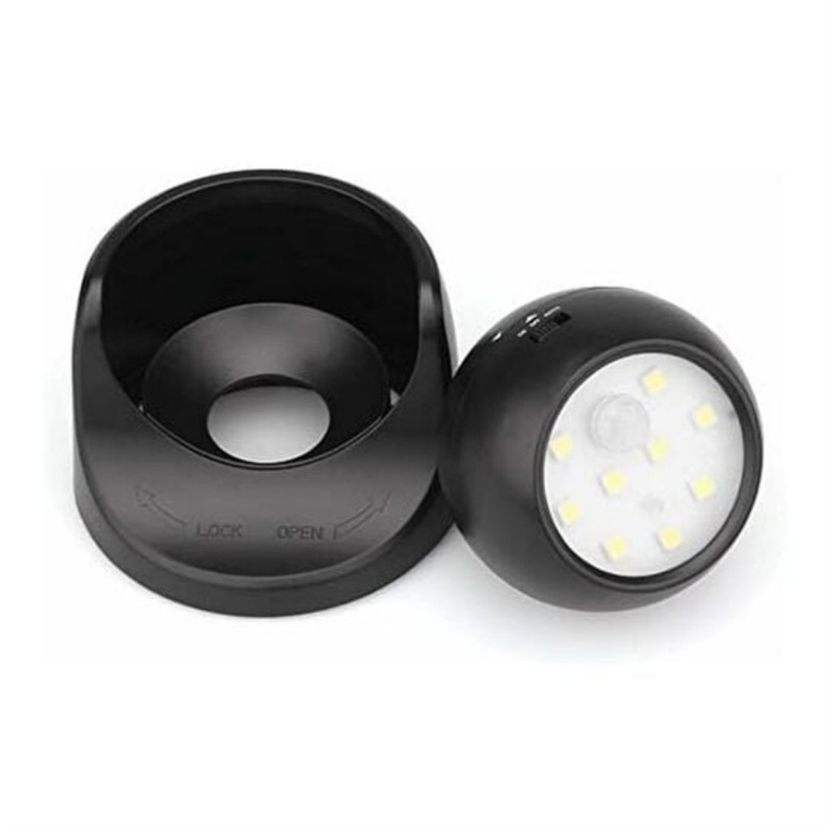 Ein schwarzes, rundes Gerät mit Sockel und abnehmbarem Kopf. Der Kopf hat Lichter, der Sockel eine Verriegelung/Öffnungs-Beschriftung.