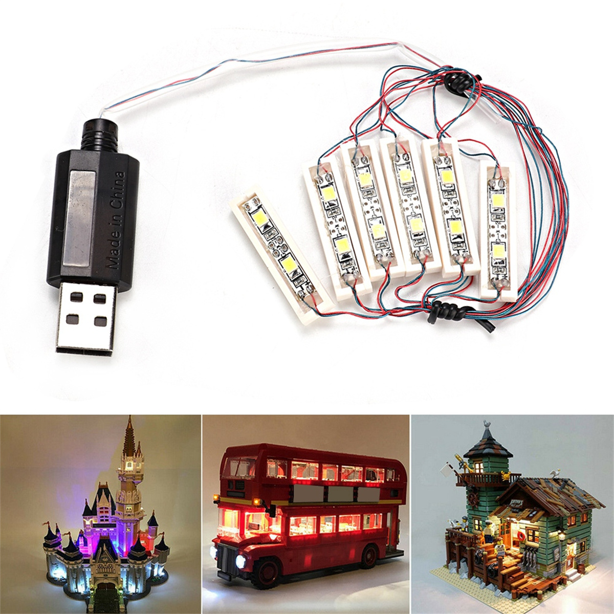 USB-Anschluss mit Lichtern und Modellen: Schloss, Bus und Haus mit Lichtern. Weißer Hintergrund.