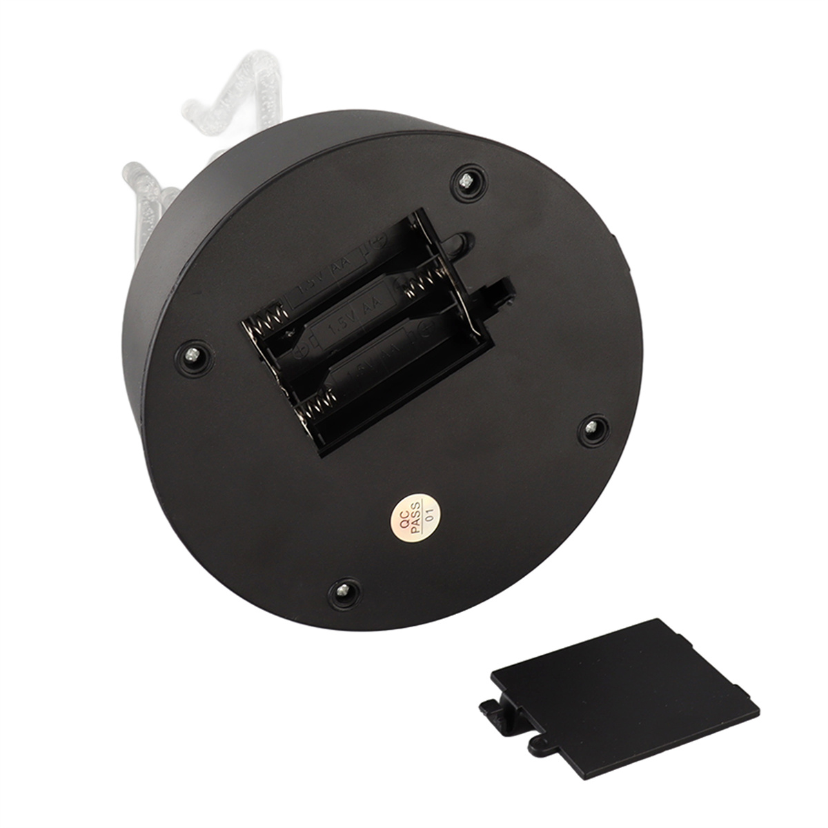 Schwarze Basis eines dekorativen Gegenstands mit offenem Batteriefach. Weiße, durchscheinende Figuren darüber.