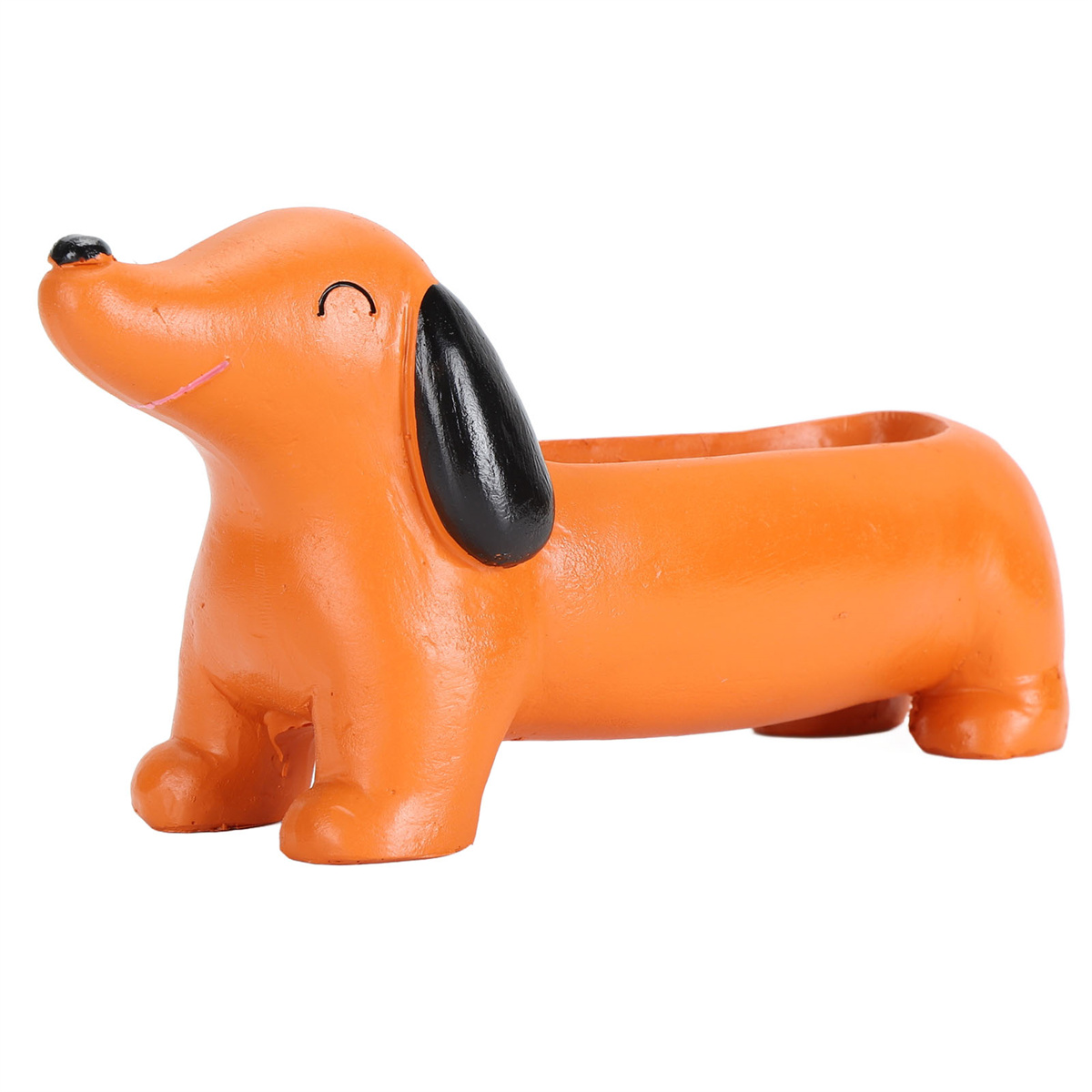 Orangener Dackel-Pflanztopf. Schwarze Ohren und Nase, lächelndes Gesicht und eine ausgehöhlte Rückseite für Pflanzen.