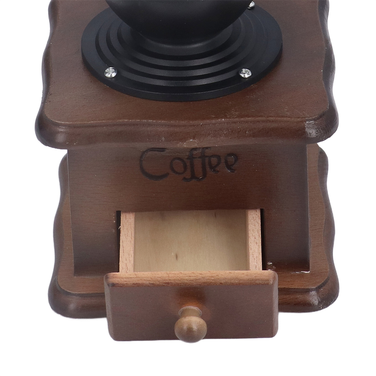Hölzerne Kaffeemühle mit offener Schublade. Schwarze Oberseite mit Griff. Weißer Hintergrund.