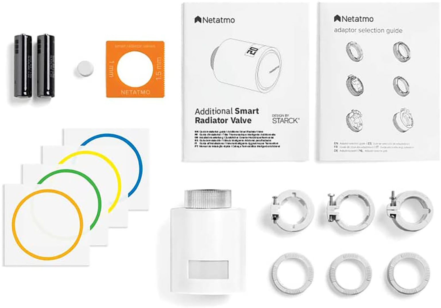 Smart radiator valve components: valve, documents, batteries, and adapters.