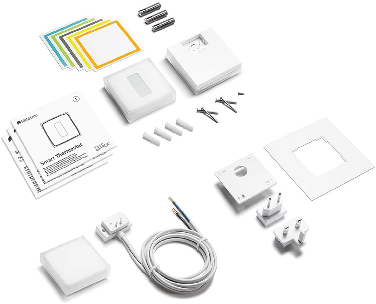 Components of a smart thermostat, including wires, screws, and the thermostat itself.