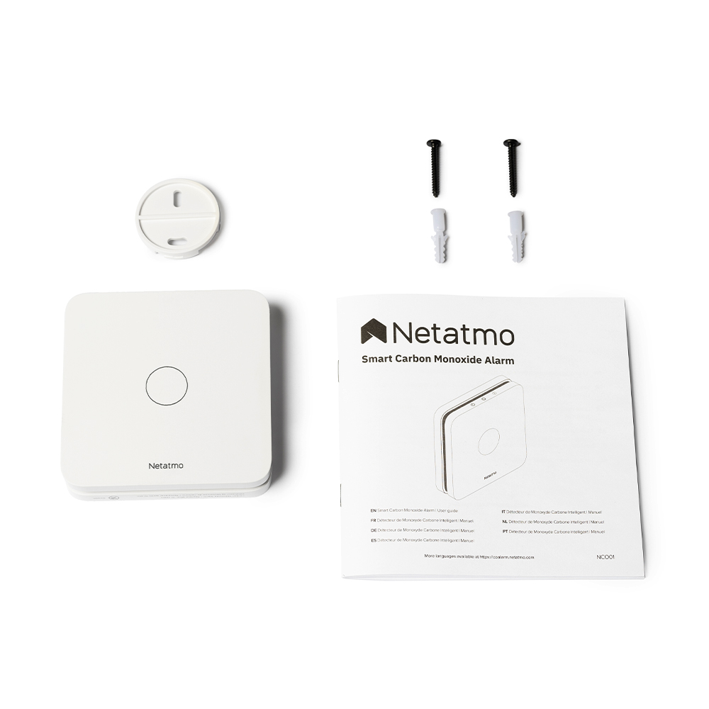 White Netatmo carbon monoxide alarm and accessories. Text: Netatmo Smart Carbon Monoxide Alarm.