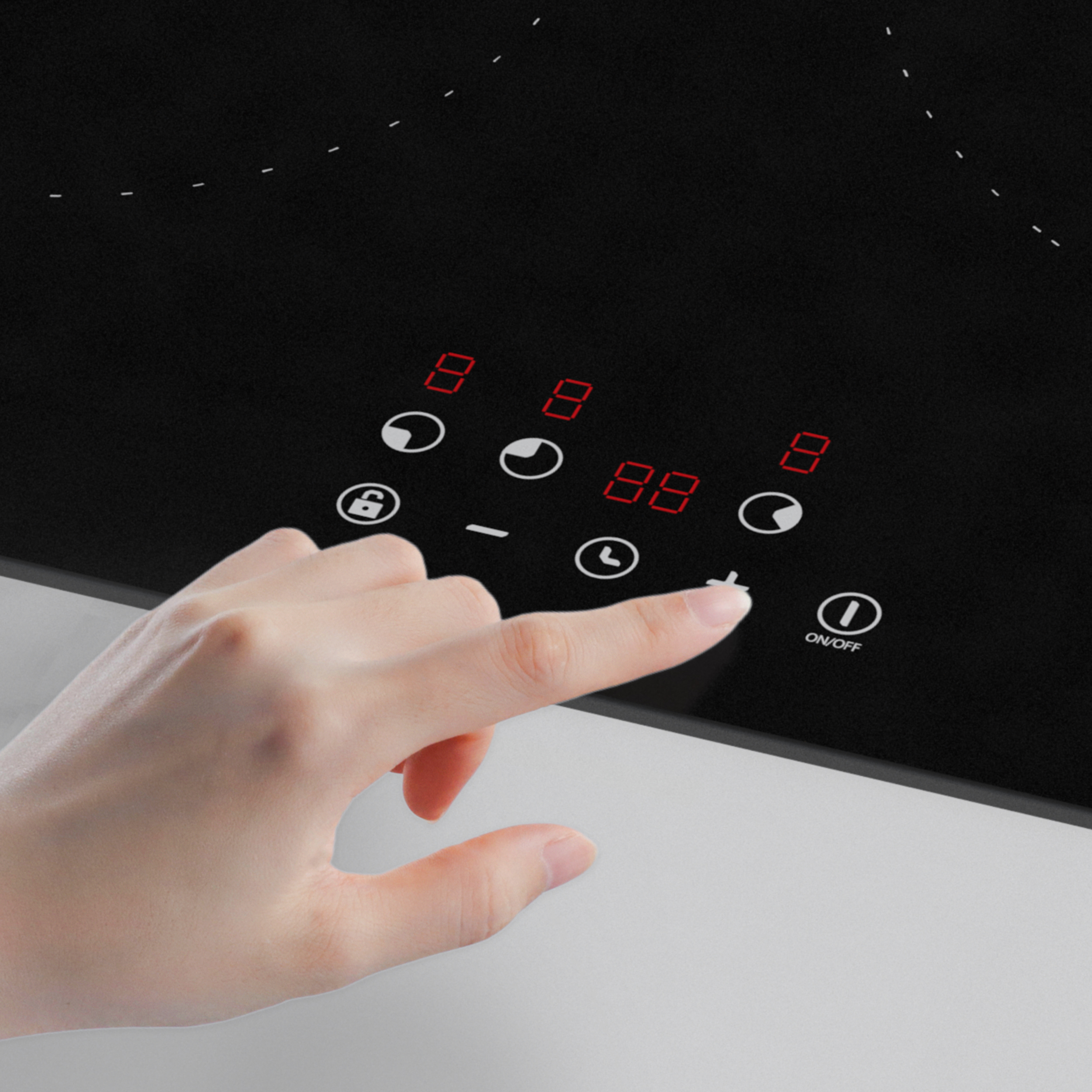 Hand touching a black induction cooktop. Red numbers on it.