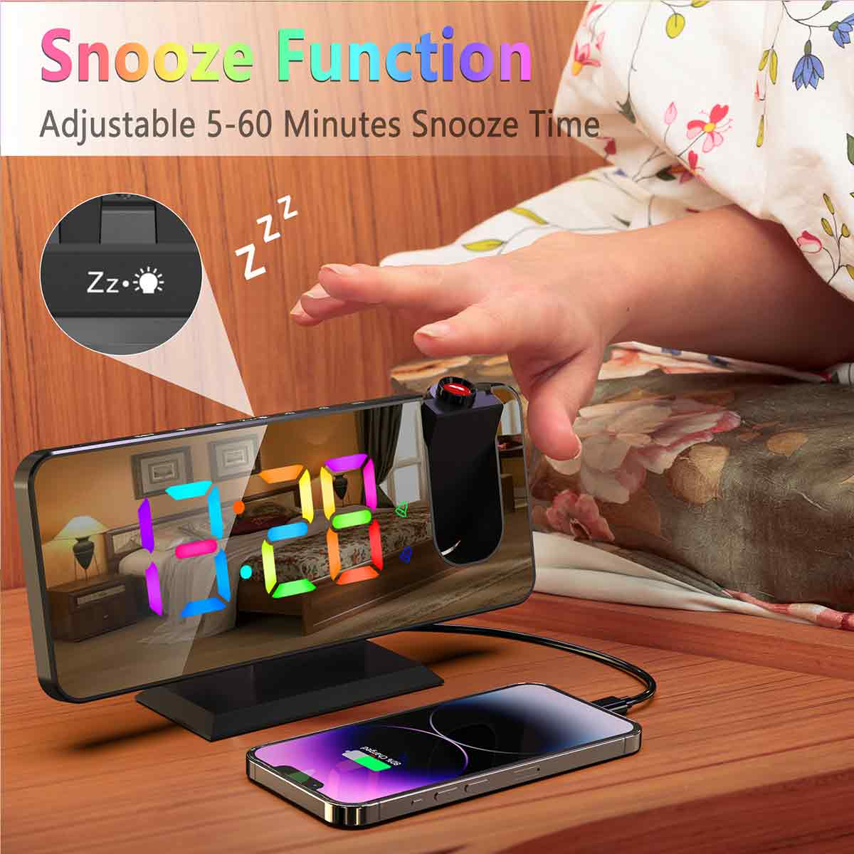 Ein Wecker auf einem Nachttisch mit einem ladenden Telefon und einer Hand, die danach greift.