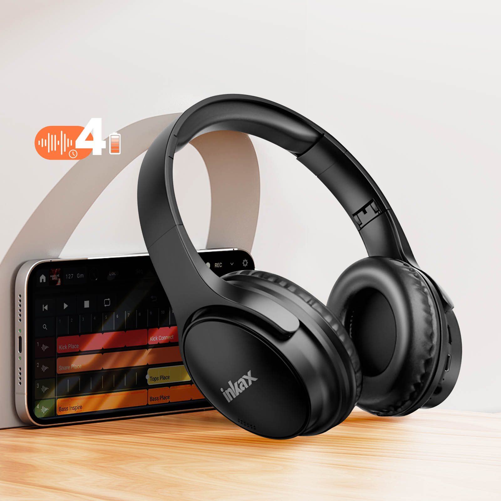 Casque noir sur un téléphone. Téléphone affiche l'application musicale. Texte : 4h batterie.