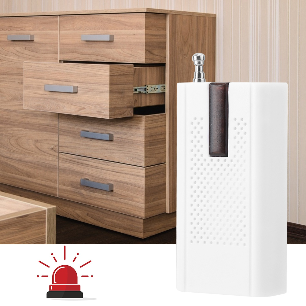 Ein weißes Alarmgerät steht neben einem Holzschrank, unten ein rotes Alarm-Icon.