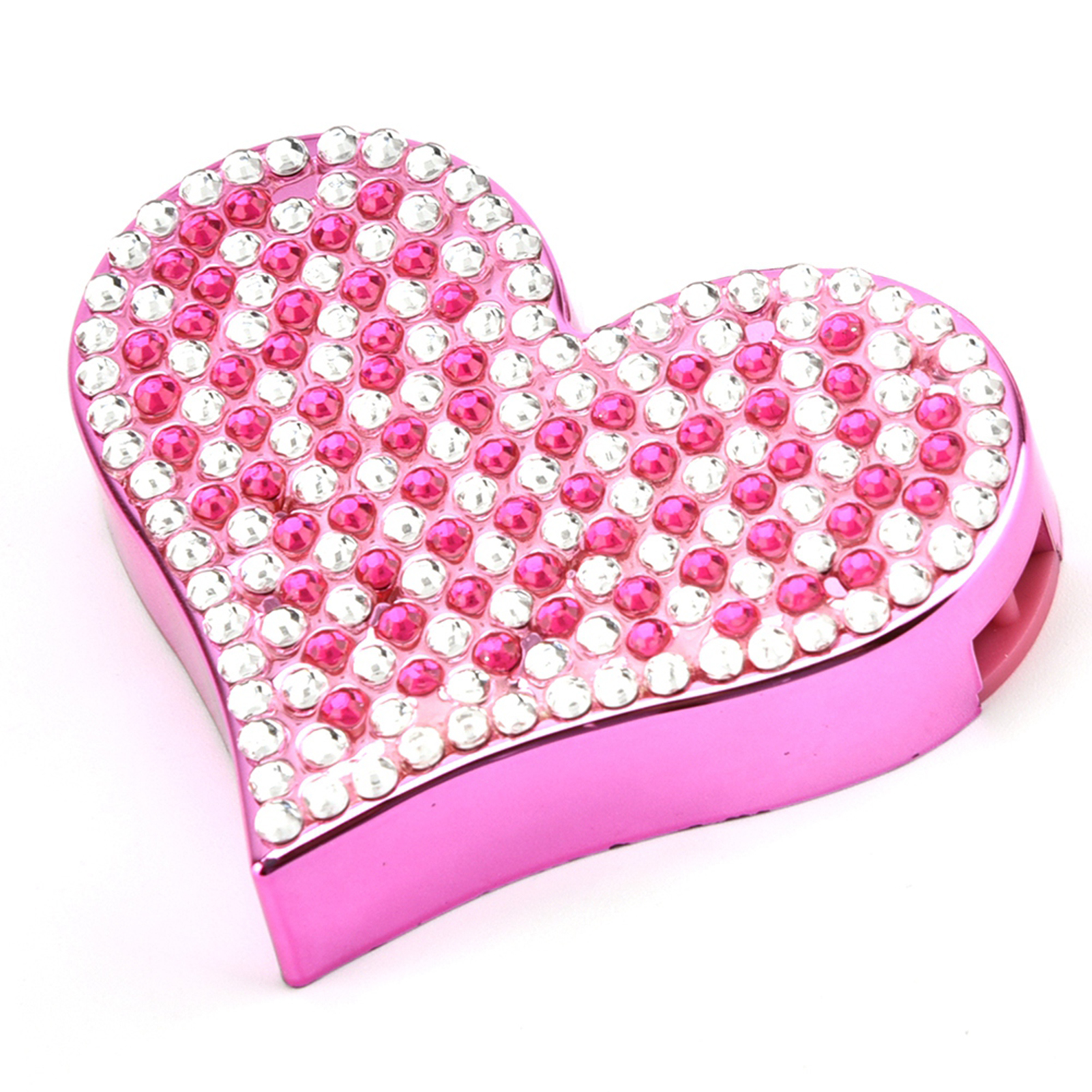 Ein pinkfarbenes herzförmiges Objekt, besetzt mit rosa und weißen Edelsteinen, auf weißem Untergrund.