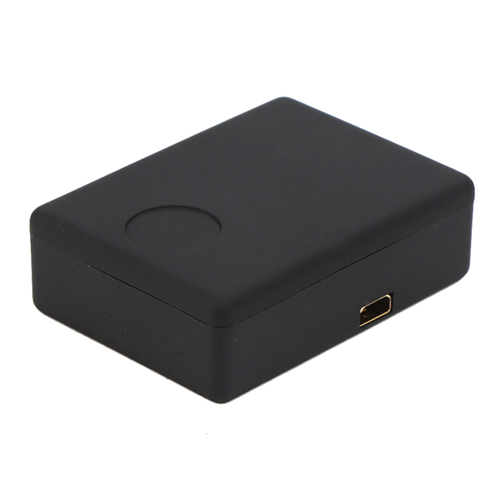 Schwarze rechteckige Box mit einer kleinen kreisförmigen Vertiefung und einem USB-Anschluss.