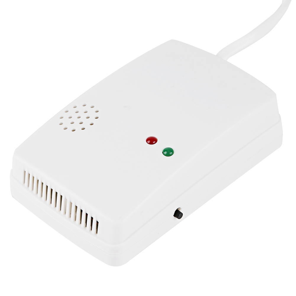 Ein weißes Gerät mit rotem und grünem Licht und einem Netzkabel.