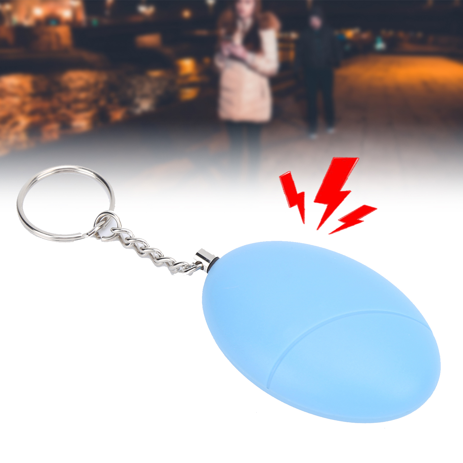 Ein blauer, ovaler persönlicher Alarm an einem Schlüsselanhänger. Rote Blitze gehen von dem Gerät aus.