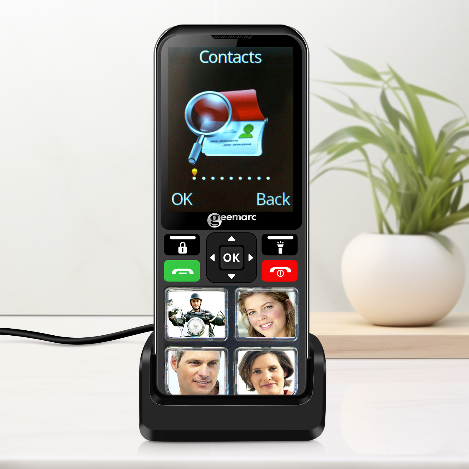Telefon mit großen Tasten, Kontaktfotos, Ladestation und weißem Hintergrund.