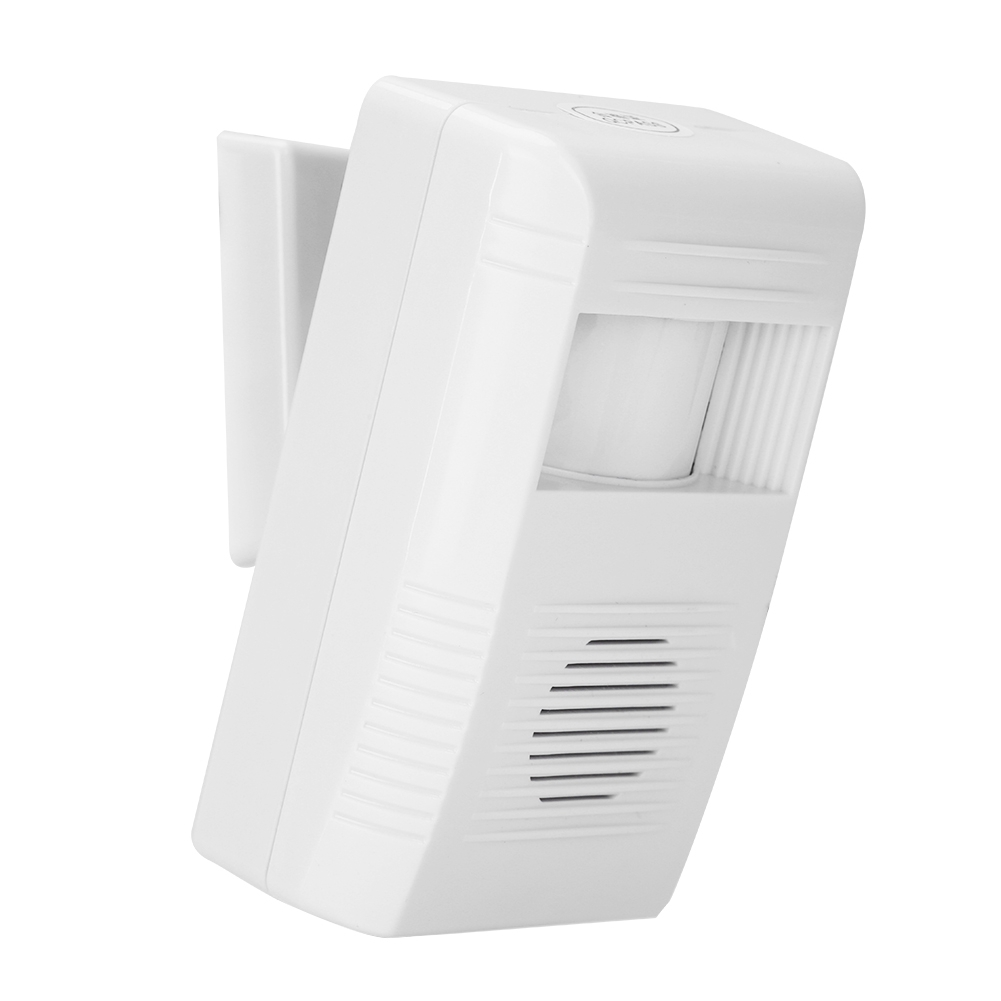 Weißer Bewegungsmelder-Alarm an einer Wand montiert. Er hat einen Lautsprecher und einen Sensor. Er ist diagonal ausgerichtet.