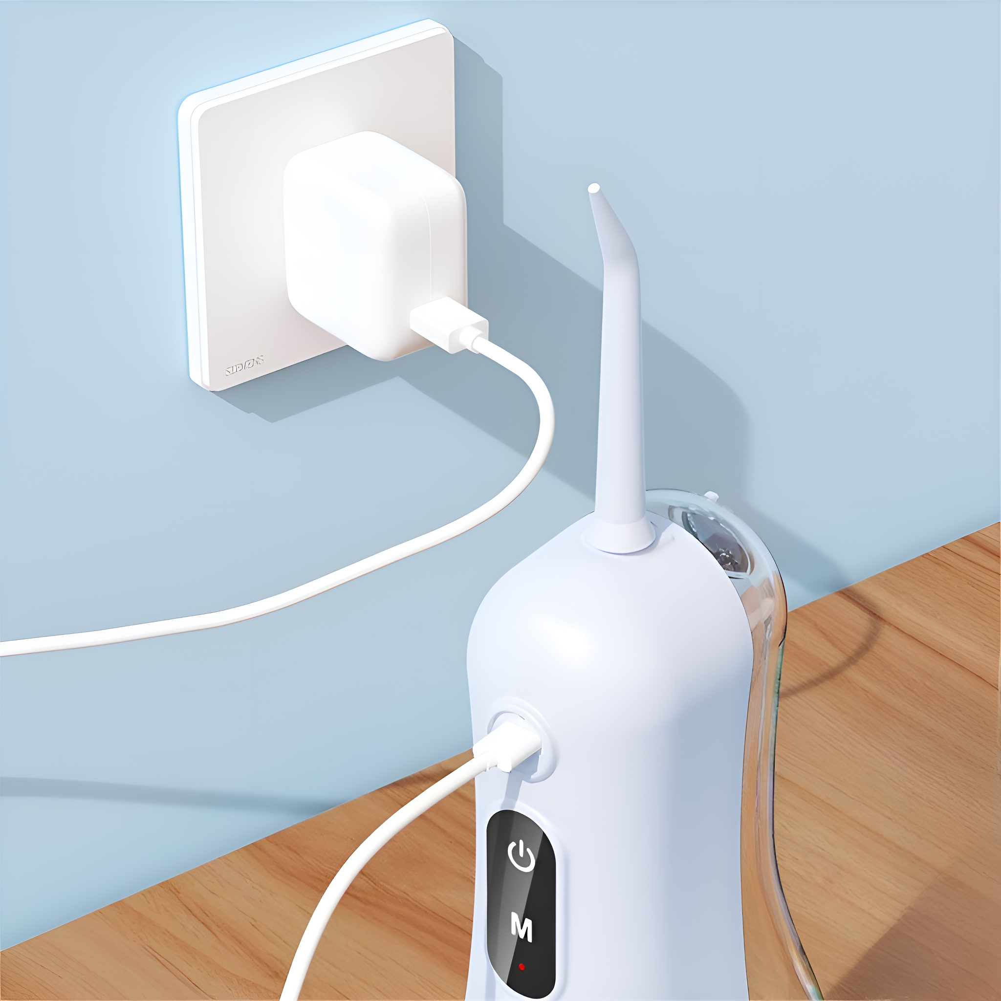 Ein weißer Munddusche ist in eine Steckdose gesteckt. Ein Ladekabel ist angeschlossen.