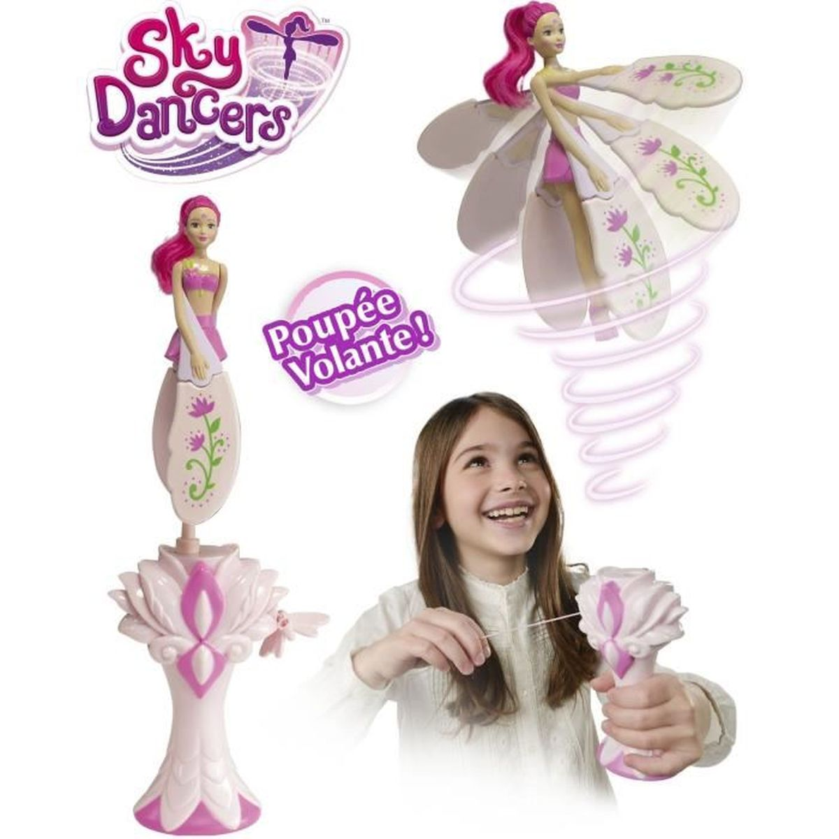 Mädchen mit Sky Dancers Spielzeug. Pinke und weiße Puppen mit Flügeln.